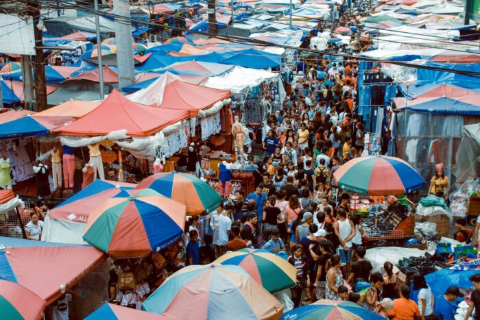 photo of crowd of people in the market